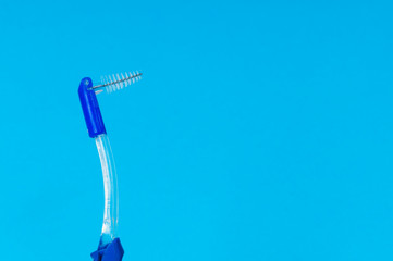 braces toothbrushes on blue background close up, mockup, copy space on the right, space for text and blank for your design