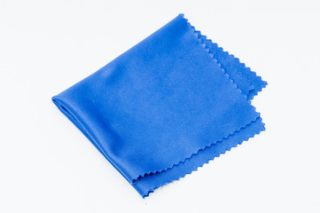blue lens cleaning material close up top view on white background