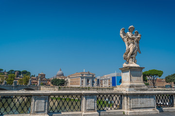 Fototapeta na wymiar On the bridge of Sant Angelo the Angel with the Crown of Thorns in Rome, Italy