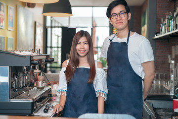 Fototapeta na wymiar smiling barista portrait in coffee shop