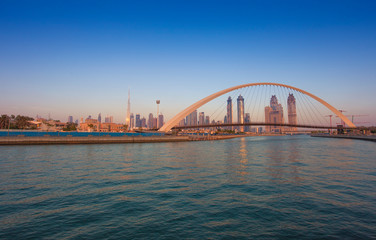 Fototapeta na wymiar Tolerance bridge and boat in Dubai city, UAE