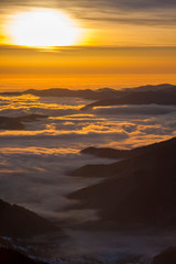 sunset and fog in the mountain landscape.