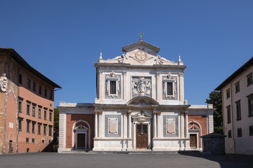Fototapeta na wymiar Ornate facade of Church of Santo Stefano dei Cavalieri, Piazza dei Cavalieri. 16th century. No people. Tuscany, Pisa, Italy