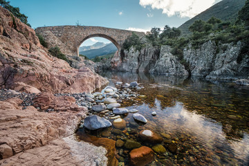 Ponte Vecchiu bridge over the Fango river in Corsica - obrazy, fototapety, plakaty