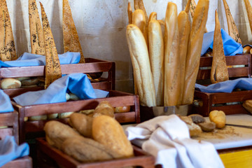 French baguettes, various types of bread in the hotel breakfast buffet.