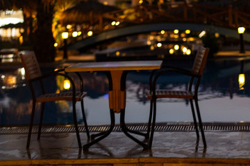 Fototapeta na wymiar A place for a romantic dinner by the pool at the resort.