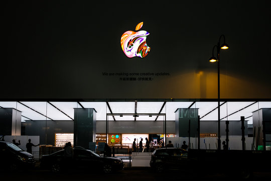 The Apple Logo on Apple Store facade in Hongkong at night - November, 2019