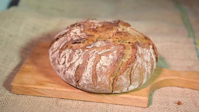breaking bread with hands on two half's