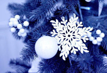 Fototapeta na wymiar Blue Christmas decoration and frosty window with lights