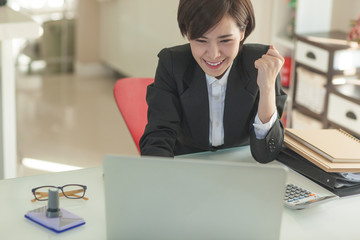 Young Asian short hair female model in formal dress which is good for business purpose