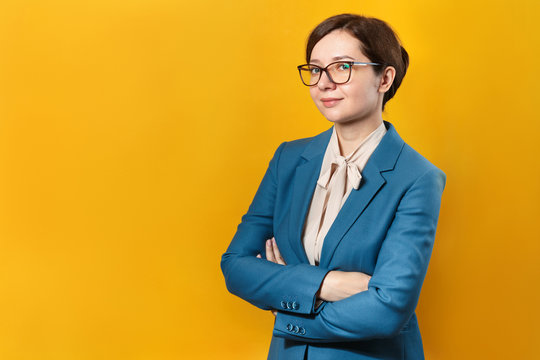 Smiling Business Woman In Glasses On A Yellow Background