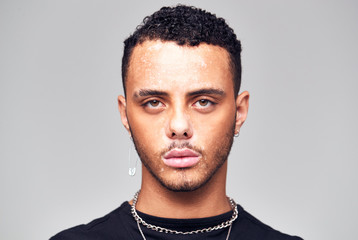 Obraz premium Studio Portrait Of Young Man With Skin Pigmentation Disorder Looking At Camera