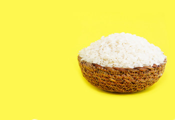 natural white rice in a decorative plate on a yellow background