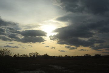 Fototapeta premium clouds over the river and meadow