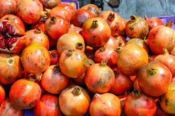 A bunch of whole ripe pomegranates.