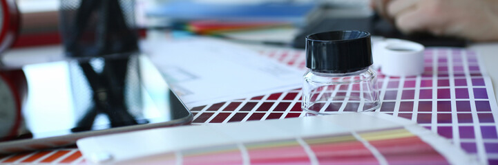 Test print paper page with colour test design fantail and magnifying glass