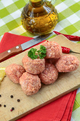 raw meatballs on a table