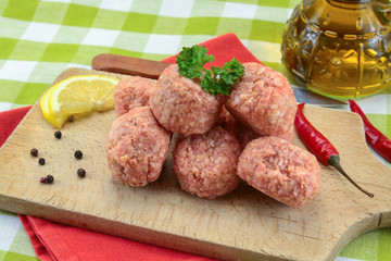 raw meatballs on a table