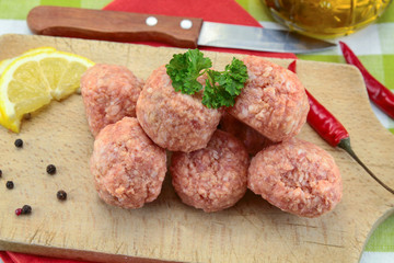 raw meatballs on a table
