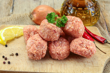 raw meatballs on a table