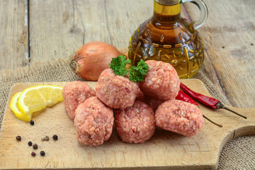 raw meatballs on a table