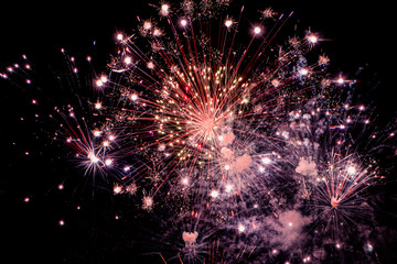 Fototapeta na wymiar Colorful fireworks on black background for winter and new year festivals.