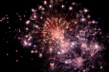 Colorful fireworks on black background for winter and new year festivals.