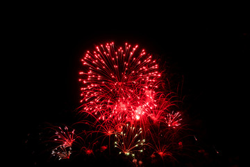 Red fireworks on black background for winter and new year festivals