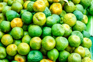 Fresh Green orange bunch in fruit stall 