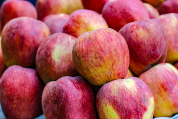 A bunch of whole ripe apple in fruit market 