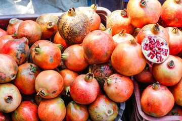 A bunch of whole ripe pomegranates.