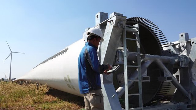 The engineer is investigating the faulty wind turbine system footage 4K