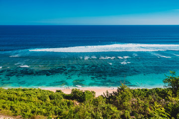 Fototapeta na wymiar Tropical sandy beach, ocean with blue water