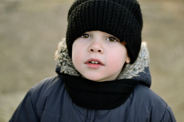 portrait of a boy in winter hat