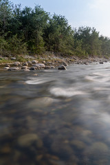 River Kosi running through the forest of the Jim Corbett national reserve - obrazy, fototapety, plakaty