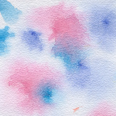 Watercolor pattern with pink and blue dots, blurred spots of paint. Abstract background for design with the texture of watercolor paper.