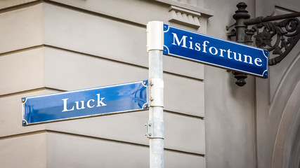 Obraz premium Street Sign to Luck versus Misfortune