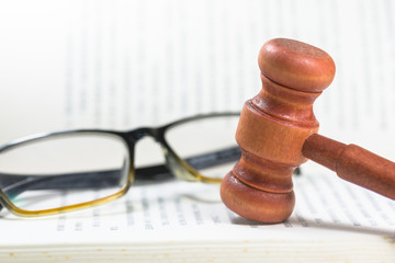A mallet (hammer) is placed on the book, copyright concept creative map