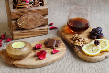 Glass of brandy with delicious snacks, all beautifully served. Relax.