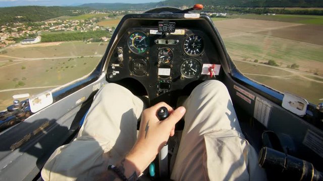 POV of pilot flying small private jet or glider