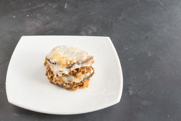 Moussaka, eggplant of aubergine. Top view in black background