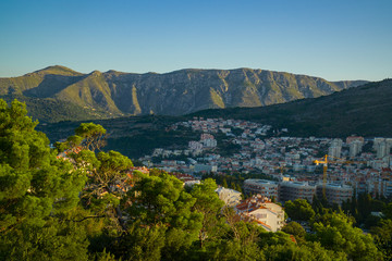 Panoramic view to the town at the foot of the mountains