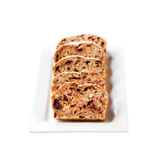 Banana cake with walnuts and dark chocolate isolated on white background