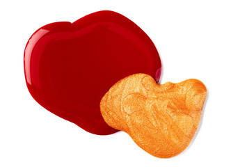 Close up of a nail polish puddle over white background