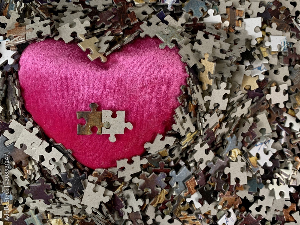 Poster background texture: heart shape on puzzle paper background. puzzle in the details in the form of a m