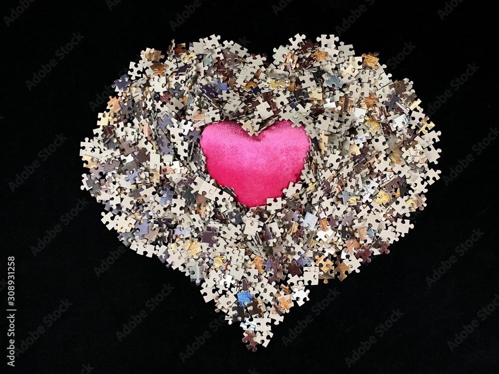 Poster background texture: heart shape on puzzle paper background. puzzle in the details in the form of a m