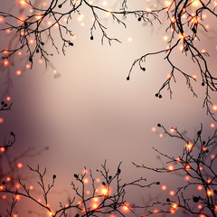 Festive garland lights sparkler on branches of trees. Beige brown ombre blurred background. Golden glitter pattern texture. Magic bokeh illustration. Fairytale forest.