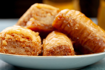 Plate of baklava dessert close up served on table