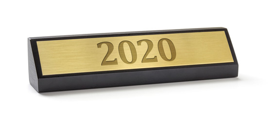 A name plate on a white background with the engraving 2020