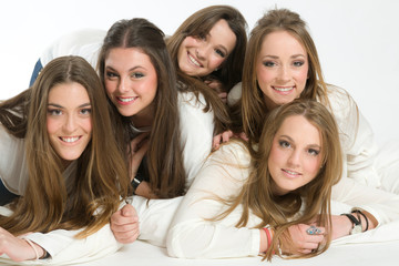 Five young women posing differently